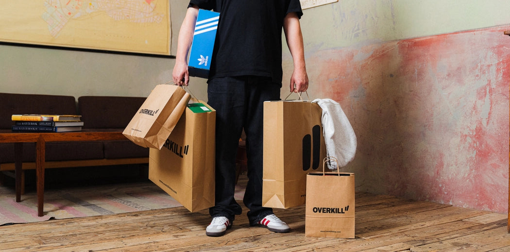  A stylish Overkill shopping bag filled with new sneakers and trendy apparel, perfect for a shopping spree!